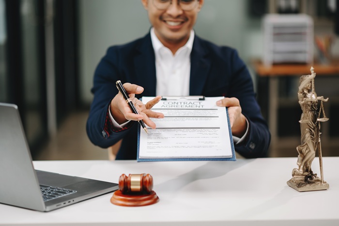 Attorney at Noble Chambers reviewing a contract agreement