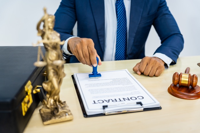Signing and stamping a legal contract